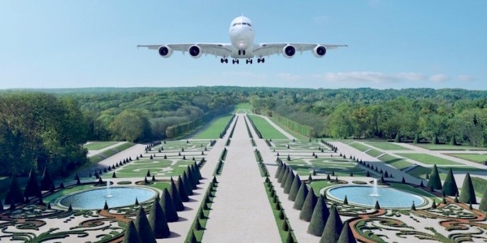 An airplane is about to land in the gardens of Versailles in this =ock-up