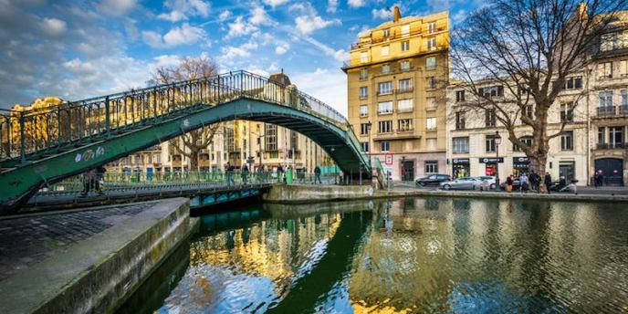 A high bridge crosses the Canal Saint Martin in Paris