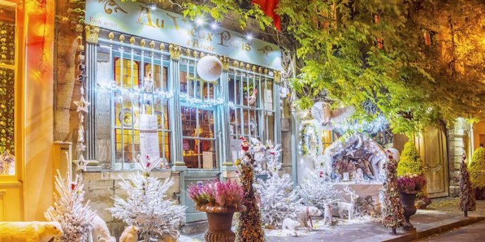 Storefront decorated for the holiday season on Christmas Day in Paris