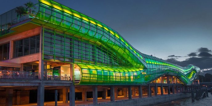 Cite de la Mode, in the 13th Arrondissement, lit with green lights at night