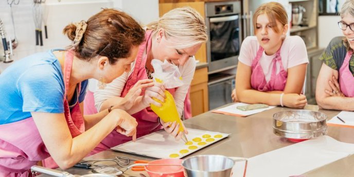 A group of visitors Learning how to Make Macarons in Paris