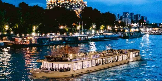 Paris river on a cheapest romantic night with Boats and lights surrounding