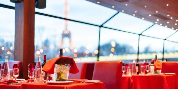 Tables set with red tablecloths for River Cruise with Lunch