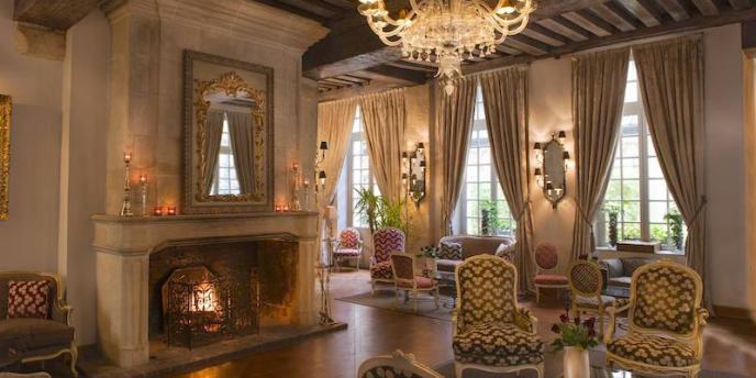 The renovated lobby at Hotel Aubusson featuring a large fireplace