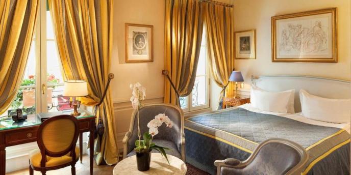 A golde-hued room at beautiful Hotel Luxembourg Parc in Paris