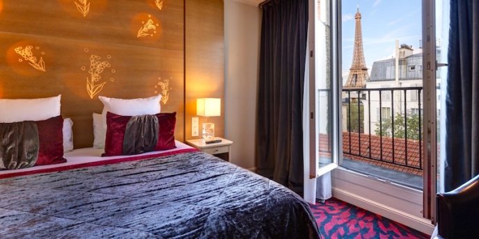 View of the Eiffel Tower from a room at Hotel Muguet Paris