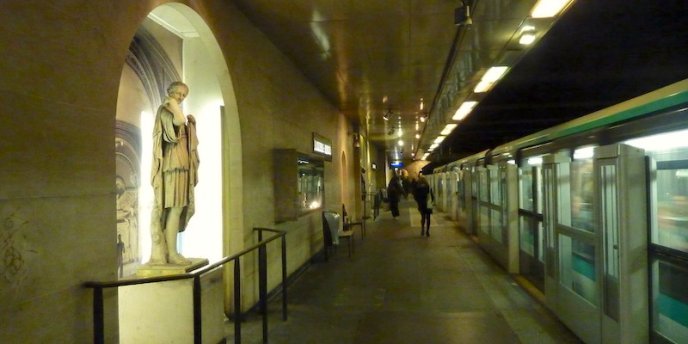 Louvre-Rivoli Metro station with statues