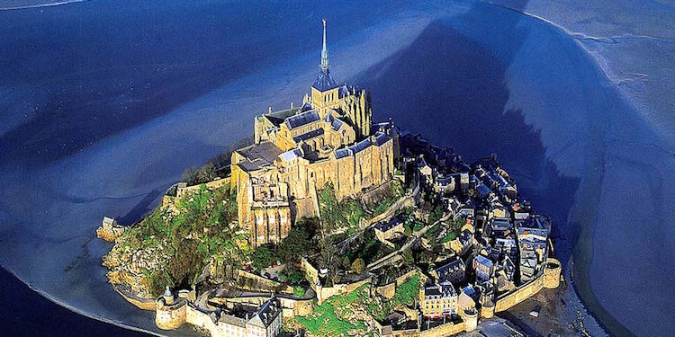 Mont St-Michel from the air, forming its own shadow