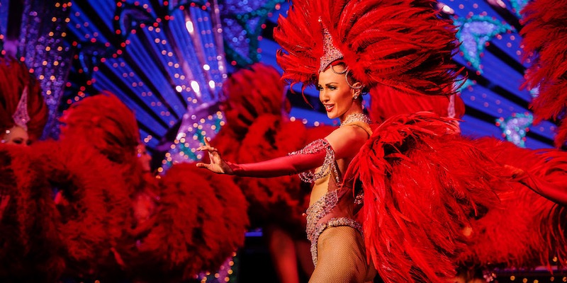 Dancers at the Moulin Rouge in Paris, dressed in red feathers