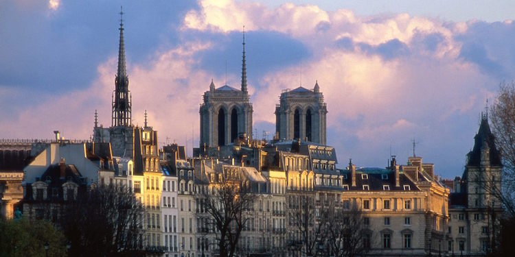 A long view of Ile de la Cite with the towers and spires of Notre Dame and La Sainte Chapelle