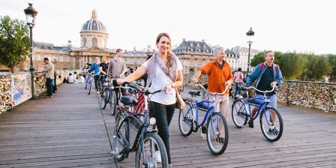 Crossing the POnt des Arts on a Paris Classic Bike Tour