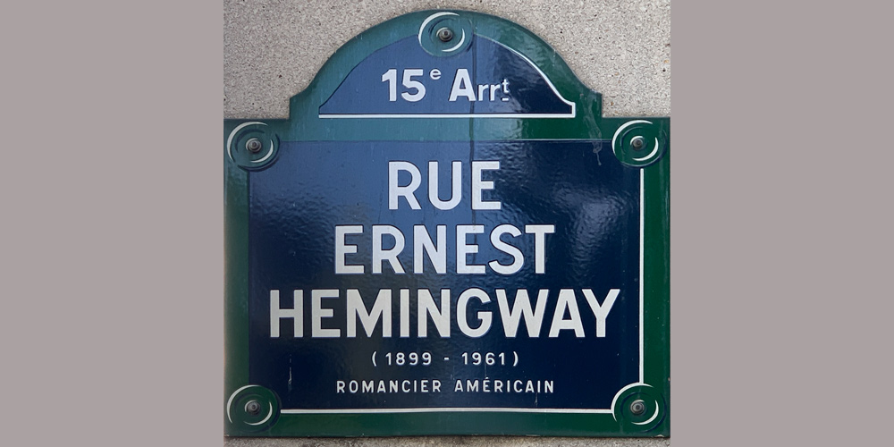 Photo of the blue and white street sign of Rue Ernest Hemingway in the 15th in Paris