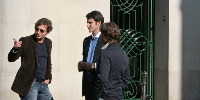 Excusez-moi, monsieur? A man on the street giving directions to two others.