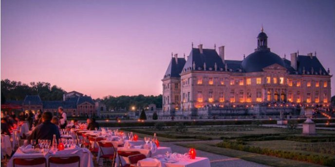 Vaux-le-Vicomte at night , set for dinner service