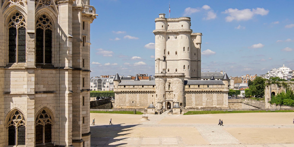 A wide view of the Chateau de Vincennes with La Sainte Chapelle in the foreground