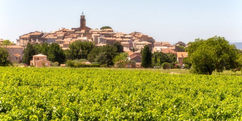 The Cote-du-Rhone hilltop wine village of Sablet seen rising above its namesake vineyards