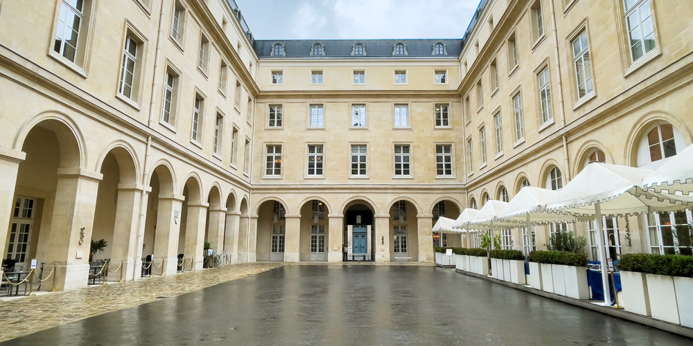 The main courtyard of Hotel de la Marine on a cloudy day in Paris