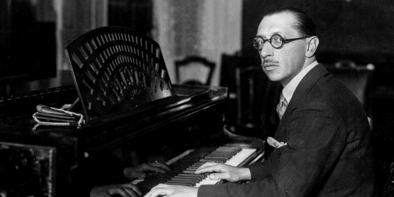 Igor Straviinsky at the piano in a black an white period photo