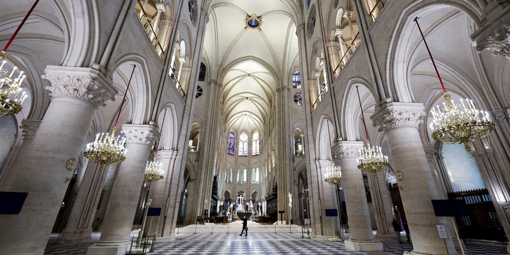 The clean white interior of Notre Dame Cathedral Paris after the restoration