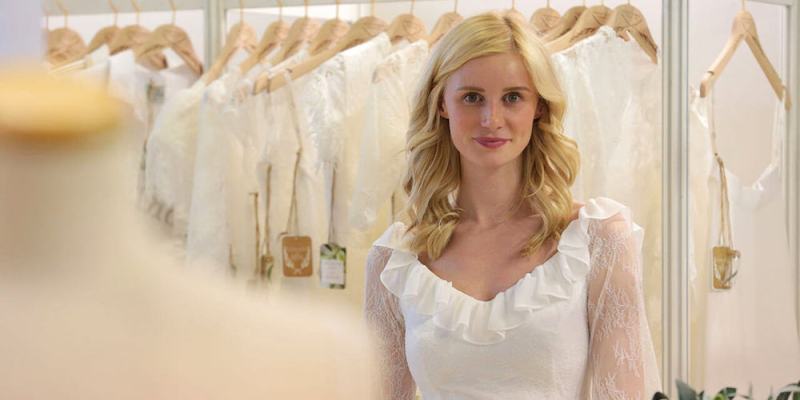 A model wearing a wedding dress at the Paris Bridal Fair