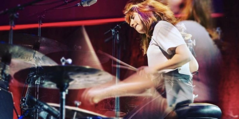 A woman drummer of a music combo in action at the Paris Jazz Festival