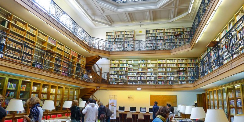 Students doing research at the spectacular 3-story library at the Paris Mineralogy Museum