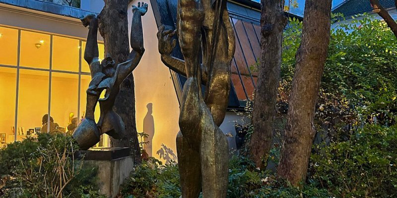 Evening in the garden of the Zadkine Museum Paris, the studio warmly lit in the background