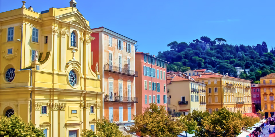 A row of colorful buildings in Nice's old town overlooking the market square