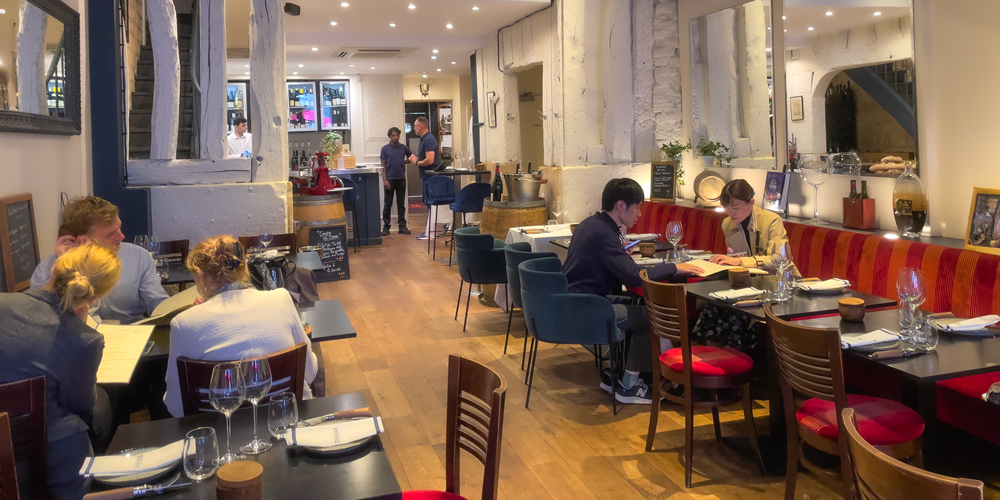 Diners in the main room of La Regalade Saint-Honore in Paris