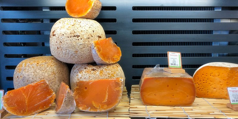 Large balls of the orange cheese, mimolette