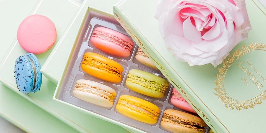 Ladurée Macarons in a box, with a rose