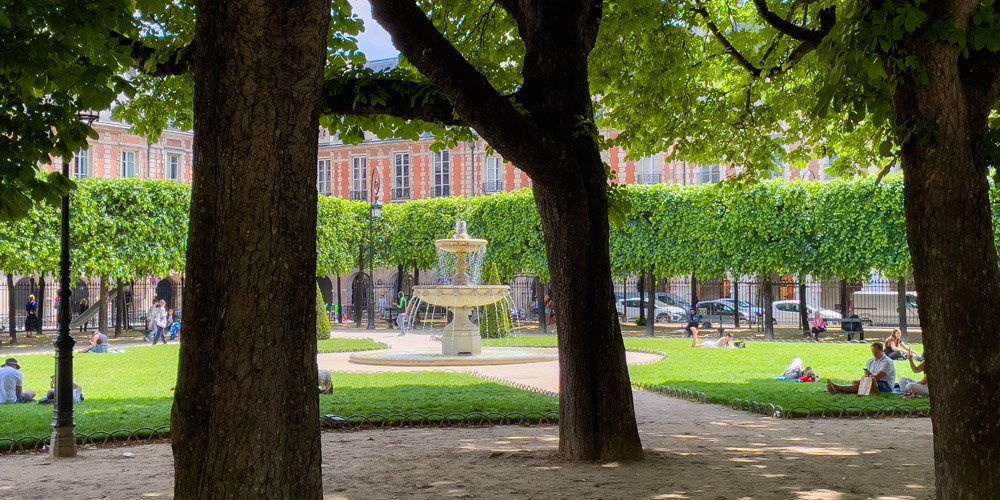 Place des Vosges fountain and trees, photo by Mark Craft