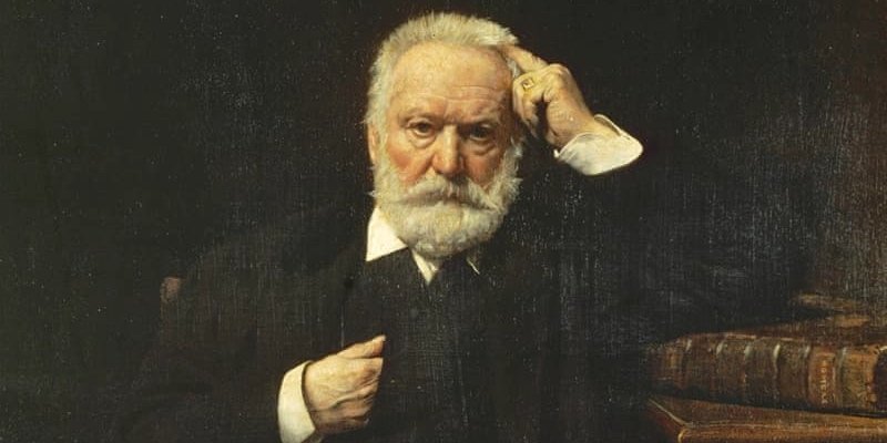 A portrait of Victor Hugo staring with seriousness out of the canvas